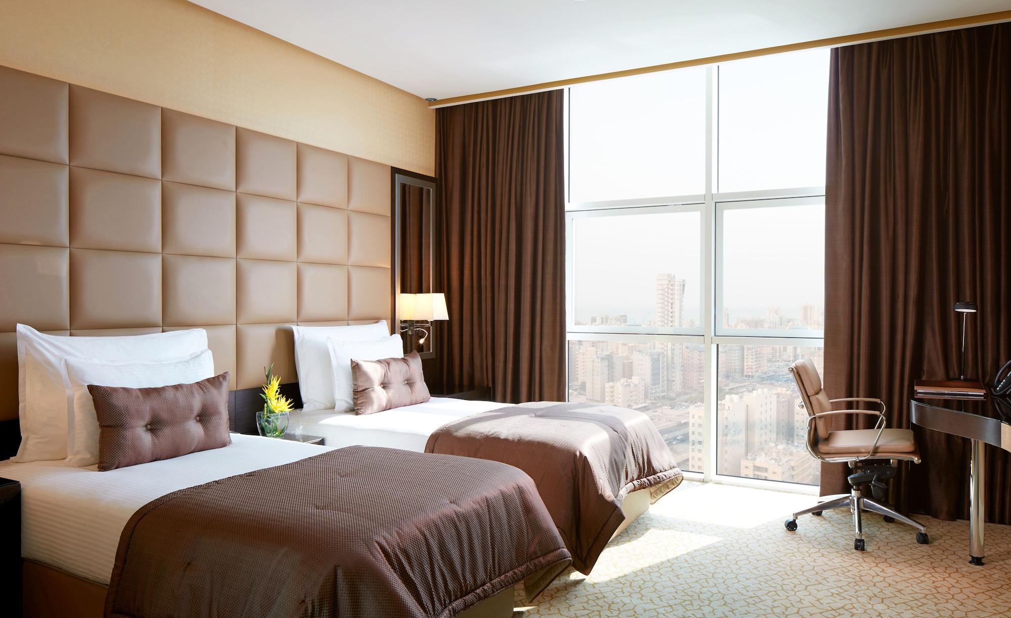 มิลเลเนียม โฮเต็ล แอนด์ คอนเวนชั่น เซ็นเตอร์ คูเวต Hotel Kuwait City ภายนอก รูปภาพ A room at the hotel