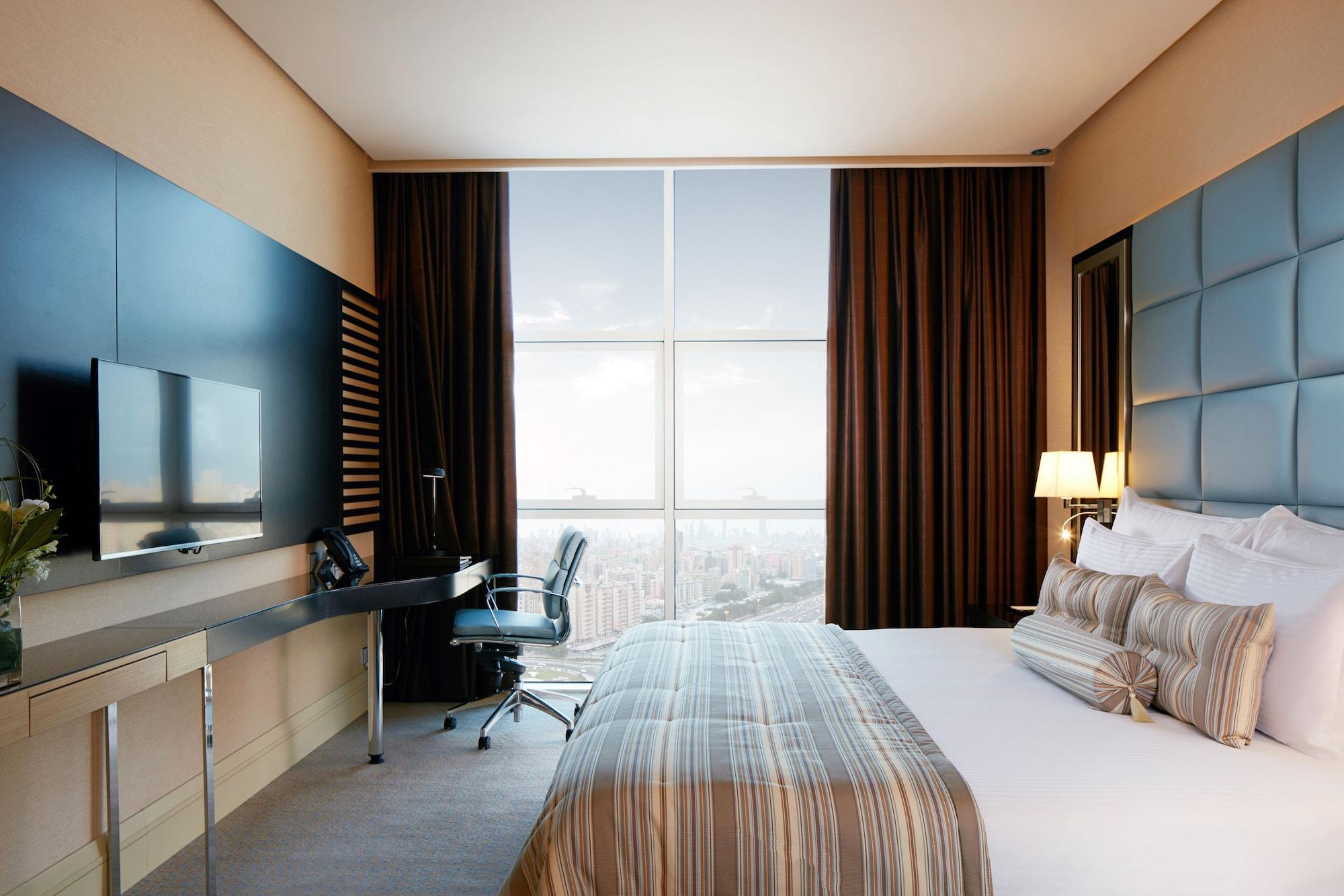 มิลเลเนียม โฮเต็ล แอนด์ คอนเวนชั่น เซ็นเตอร์ คูเวต Hotel Kuwait City ภายนอก รูปภาพ A bedroom at the hotel